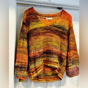 Women’s multi color sweater sized medium